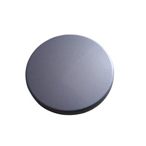 May include: A solid, circular, metallic gray object with a slightly textured surface. The object has a dark gray edge and is set against a white background. The item appears to be a lid or cover.