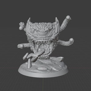 Può includere: Un modello stampato in 3D di una creatura mostruosa con un solo grande occhio, una bocca spalancata e tentacoli multipli. La creatura è in piedi su una base rocciosa.