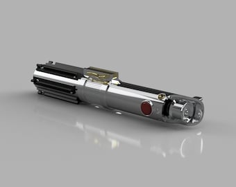 May include: A silver lightsaber with black and gold detailing, a red button, and a clear emitter. The hilt has a detailed design with a metallic finish. The lightsaber is a prop from a science fiction franchise.
