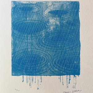 May include: Blue and white art print depicting a rainy scene. The artwork features concentric circles and diagonal lines suggesting raindrops. The print has a square format with drips at the bottom and is numbered 192/200. Signed by the artist.