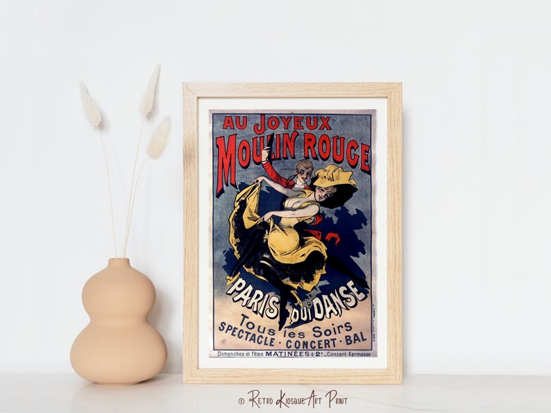 May include: A vintage poster advertising the Moulin Rouge in Paris, France. The poster features a couple dancing, with the woman in a yellow dress and the man in a red suit. The text on the poster reads "Au Joyeux Moulin Rouge" and "Paris Pour La Danse".