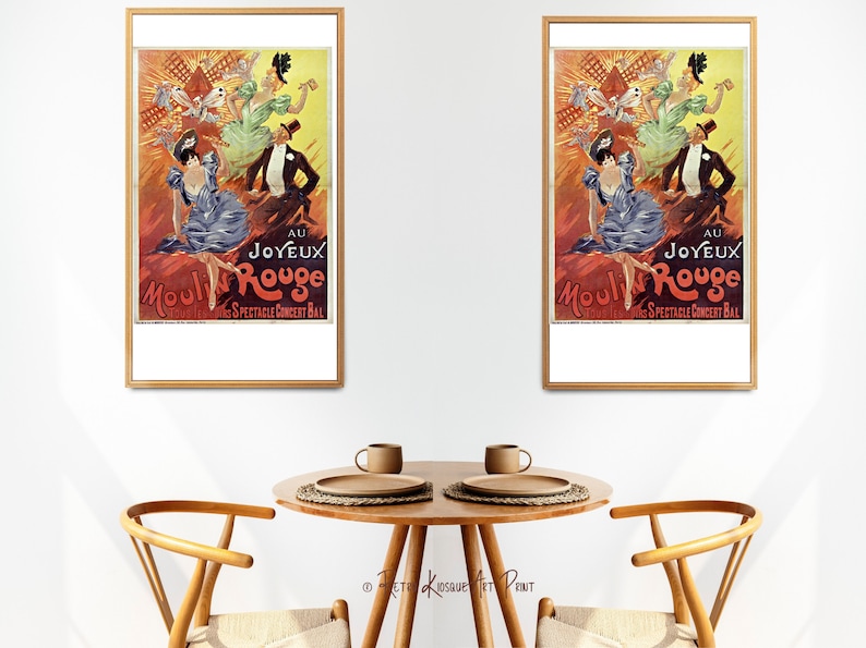 May include: Two framed vintage posters of the Moulin Rouge cabaret in Paris, France. The posters feature a red background with a windmill and dancers in colorful costumes. The text on the posters reads "Au Joyeux Moulin Rouge" and "Grand Spectacle Concert Bal".