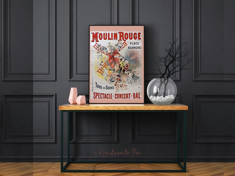 May include: A vintage poster advertising the Moulin Rouge cabaret in Paris, France. The poster features a red windmill with dancers and performers in front of it. The text on the poster reads "Moulin Rouge, Place Blanche, Tous les Soirs, Spectacle-Concert-Bal."