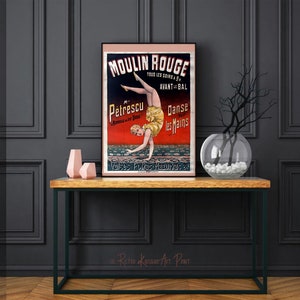 May include: Vintage Moulin Rouge poster featuring a woman in a yellow and red costume performing a handstand. The poster is printed on paper and has a red, black, and white color scheme. The text on the poster reads "Moulin Rouge", "Petrescu", "Danse les Mains", and "Valses Polkas Mazurkas".