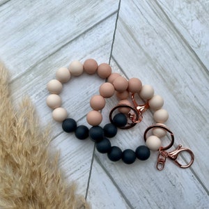 Rubor neutro • pulsera llavero • muñequera • manos libres • elástica