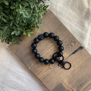 porte-clés noir mat • mains libres • bracelet • hexagone