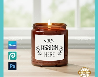 May include: A lit brown glass jar candle with a white label that reads "YOUR DESIGN HERE". The candle has a lit wick and is on a wooden surface. The image also includes the Canva, P, and Ps logos.