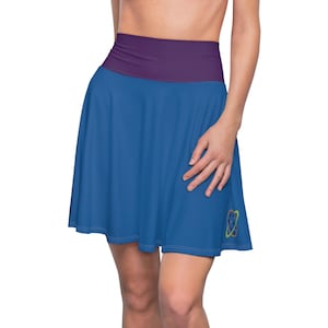 May include: A blue skater skirt with a wide purple waistband. The skirt features a colorful, abstract design near the hem. The skirt is made of a smooth, flowing fabric, suitable for active wear.