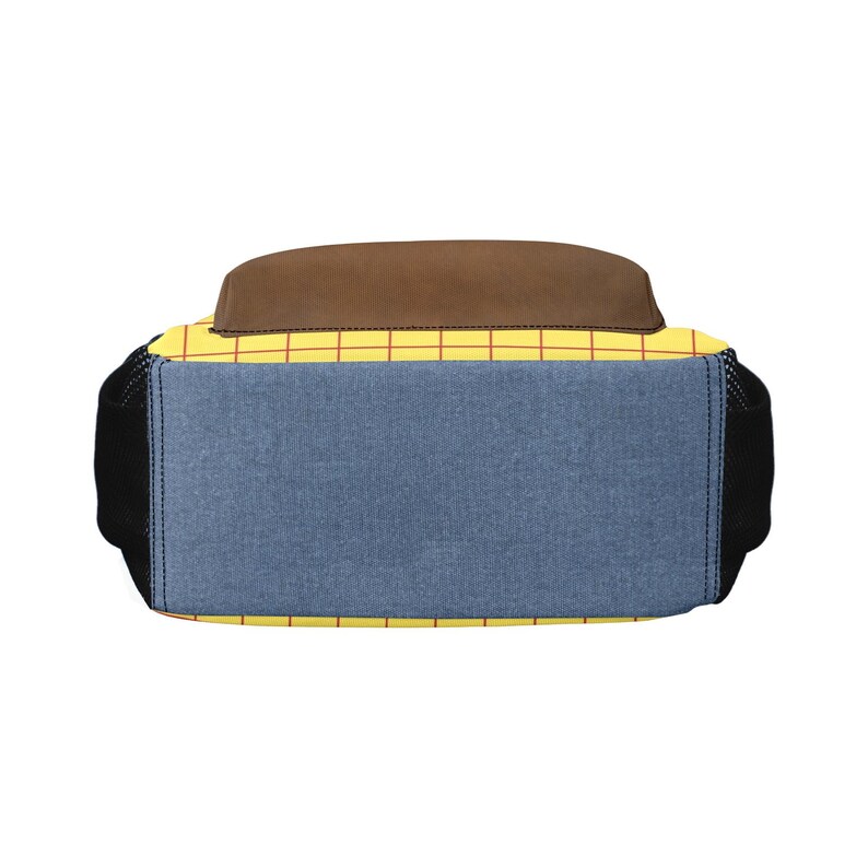 May include: A backpack featuring a yellow base with a red grid pattern, a solid brown top panel, and a blue denim-textured front pocket. The sides are black mesh, and the design incorporates a structured rectangular shape with visible stitching.