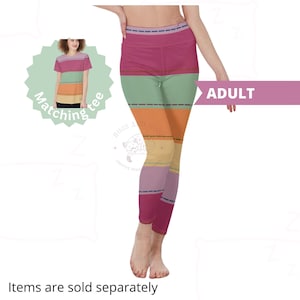 May include: Adult leggings with a colorful striped pattern in shades of pink, green, orange, yellow, and purple. The leggings have a high waist and a fitted silhouette. The image also shows a matching tee shirt with the same striped pattern.