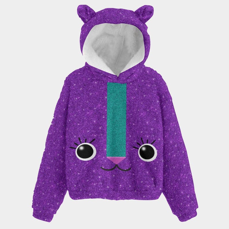 May include: A purple hooded sweatshirt with a cat face design. The sweatshirt features a glittery texture, a teal stripe down the front, and a white-lined hood with cat ears. The cat face includes large black eyes, eyelashes, and a pink nose.