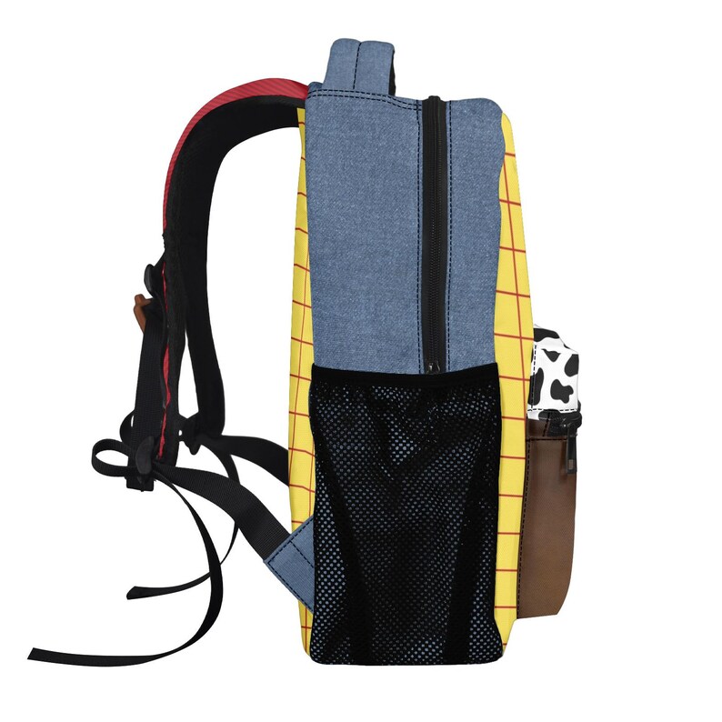 May include: A backpack featuring a yellow body with a red grid pattern, blue denim-like side panels, and a black mesh side pocket. The front pocket displays a black and white cow print above a solid brown base, with black adjustable shoulder straps.