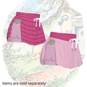 May include: Two athletic skirts, one pink with horizontal stripes and the other solid light pink. Both have a pocket with a butterfly design and white drawstring. The text "Items are sold separately" is at the bottom.