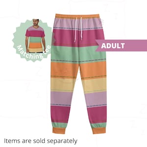 May include: Multicolored striped sweatpants with a drawstring waistband. The sweatpants have a pink, green, orange, and yellow striped pattern. The text "ADULT" is visible in the image.