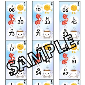以下が含まれることがあります： 朝食をテーマにしたカラフルなビンゴカードが9枚。各カードには1から9までの異なる番号が付けられています。画像は目玉焼き、ベーコン、コーヒーカップです。カードの番号は06から73までです。