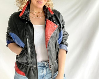 Veste vintage des années 80 | Taille M/L | Cuir | Noir avec détails bleus et rouges