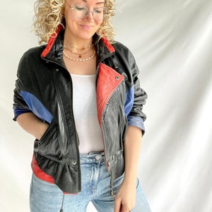 Veste vintage des années 80 | Taille M/L | Cuir | Noir avec détails bleus et rouges