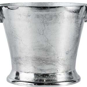 May include: Silver ice bucket with bull head handles. The bucket has a textured surface and a wide base.