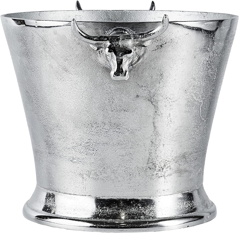 May include: Silver ice bucket with a bull head design on the handle.