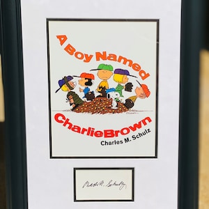 Charles M. Schultz: “A Boy Named Charlie Brown”, Autograph, with included Print, Framed