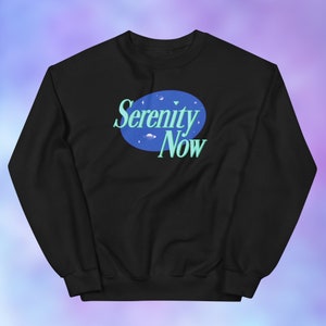 May include: Black sweatshirt with a blue circle and the text "Serenity Now" in a light blue font.