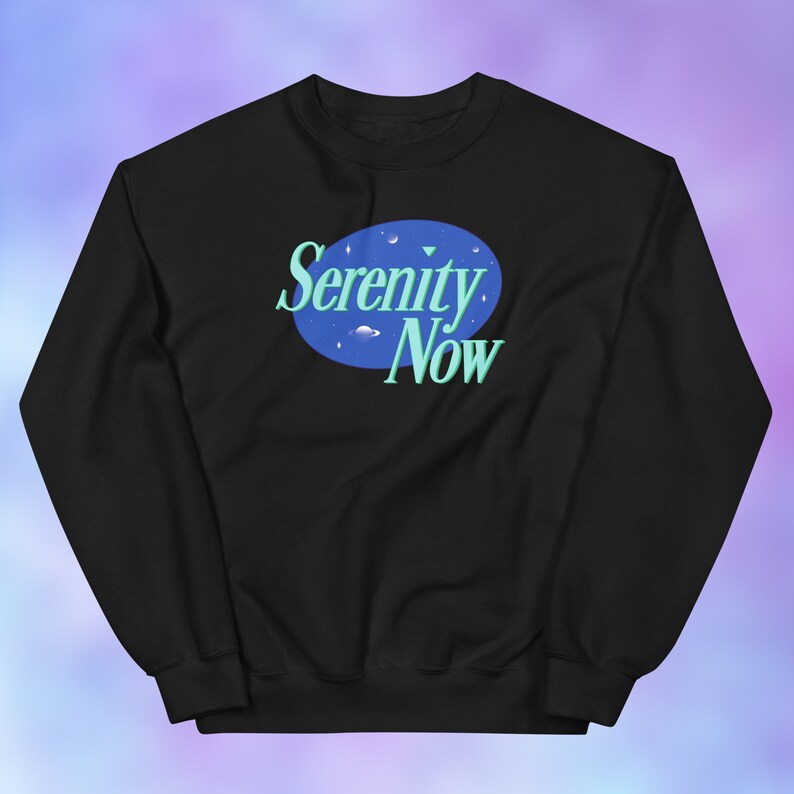 May include: Black sweatshirt with a blue circle and the text "Serenity Now" in a light blue font.