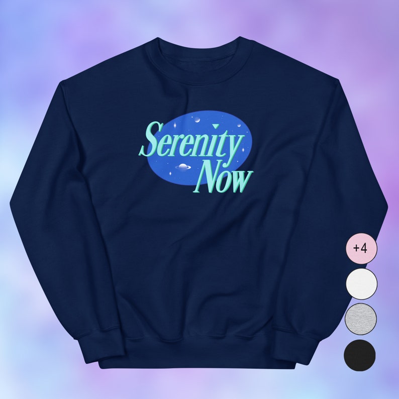 May include: Navy blue sweatshirt with a white circle and the text "Serenity Now" in a blue and green font. The circle has a small planet and stars inside.