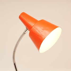 Orange Vintage Table Lamp with Horn Cap and Round Foot Base that Fits into a Retro Interior or to use as a gift for People who just Moved in