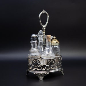 English Antique Cruet set With a Silver Plated Carrier Consisting a Salt Bottle and Pepper Bottle With a Mustard Jar and Vinegar Bottle