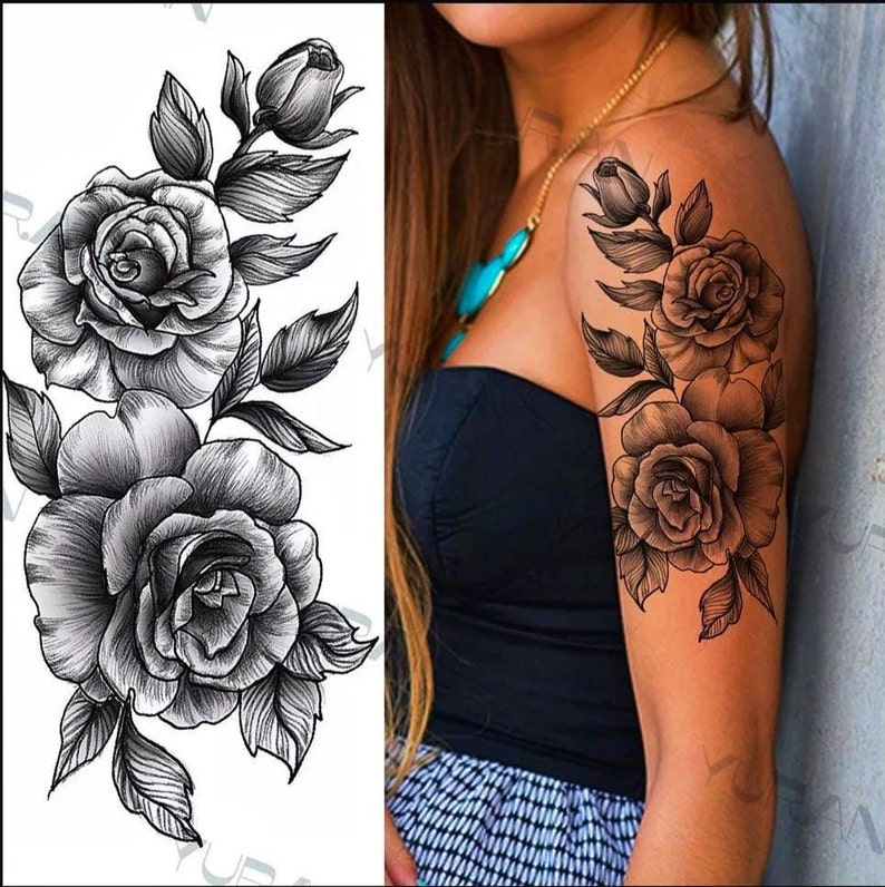 May include: Black and white temporary tattoo featuring a floral design with three roses and leaves.