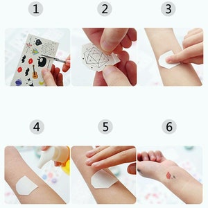 May include: Six steps on how to apply temporary tattoos. The steps are numbered 1 through 6. Step 1 shows a sheet of temporary tattoos with a variety of designs. Step 2 shows a person peeling off a temporary tattoo. Step 3 shows a person applying a temporary tattoo to their arm. Step 4 shows a person applying a clear liquid to their arm. Step 5 shows a person pressing down on the temporary tattoo. Step 6 shows a temporary tattoo on a person's arm.