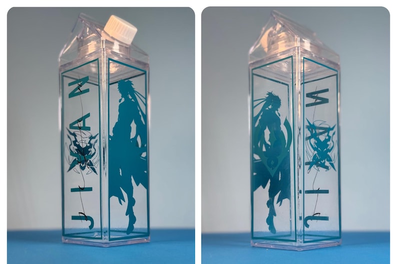 May include: Clear plastic milk carton-shaped water bottle with a teal graphic of a character and the word "JIA" in teal. The bottle has a white cap and is displayed against a blue background.