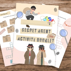 May include: An activity booklet titled "Secret Agent" featuring illustrations of a thief, detectives, and magnifying glasses. The booklet includes word puzzles and a crossword. The cover text reads "Secret Agent Activity Booklet".