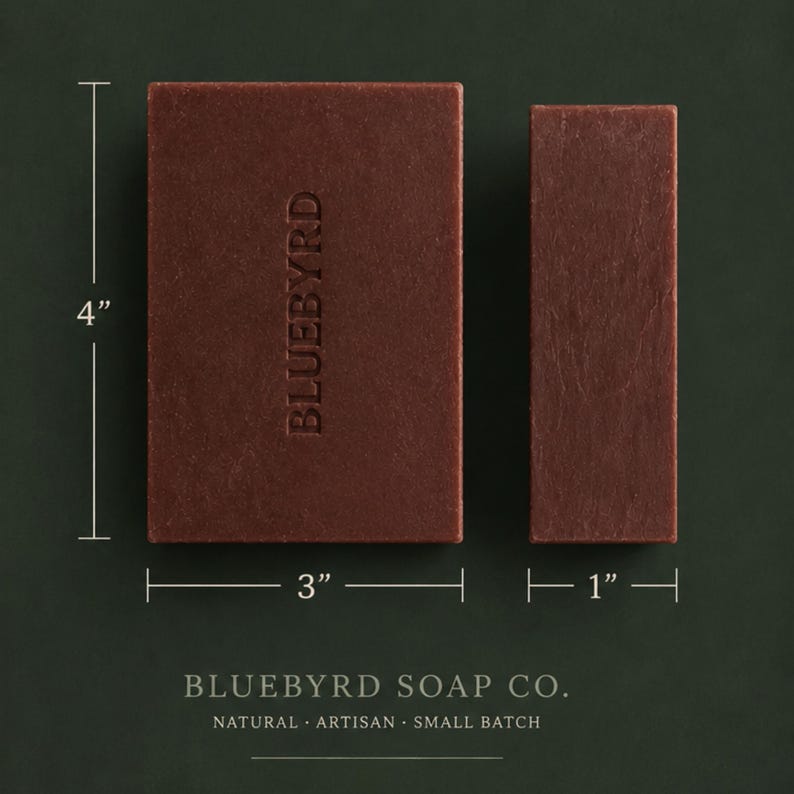 May include: Two rectangular bars of dark reddish-brown soap. The larger bar measures 4 inches by 3 inches and features the embossed text BLUEBYRD. The smaller bar measures 4 inches by 1 inch. The text BLUEBYRD SOAP CO. appears at the bottom.