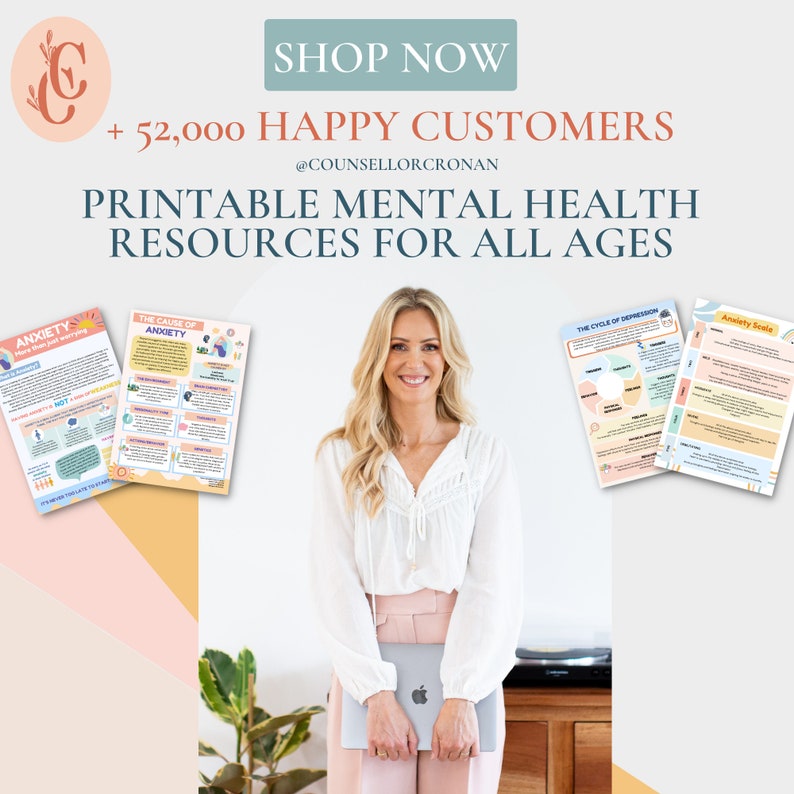 May include: A woman in a white shirt and pink pants stands in front of a laptop computer. She is smiling. Four printable mental health resources are displayed on the wall behind her. The resources are titled "Anxiety", "The Cause of Anxiety", "The Cycle of Depression", and "Anxiety Scale". The text "+ 52,000 Happy Customers" and "@CounsellorCronan" are also displayed on the wall. The text "Printable Mental Health Resources for All Ages" is displayed in large letters at the top of the image.