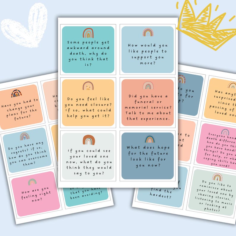 May include: A set of colorful conversation cards with rainbow designs. The cards feature questions about grief, loss, and coping with death.  The text on the cards includes phrases like "How would you like people to support you more?" and "Do you feel like you need closure?"
