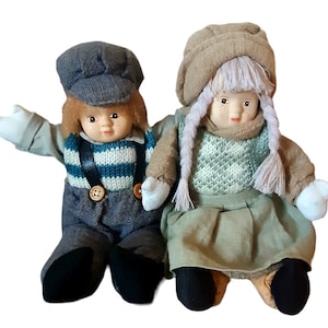 Vintage Pair Porcelain Faced Boy and Girl Dolls