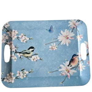 May include: A rectangular serving tray with a light blue background featuring a printed pattern of white and pink cherry blossoms, two small birds perched on branches, and a single blue butterfly. The tray includes two integrated side handles.