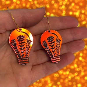 Gorgeous radiant acrylic flower engraved light bulb statement acrylic earrings