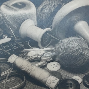 May include: A monochrome image featuring various sewing items: thread spools, balls of yarn, buttons, scissors, and a measuring tape. The composition emphasizes the textures of the materials. Needles are placed in the yarn.