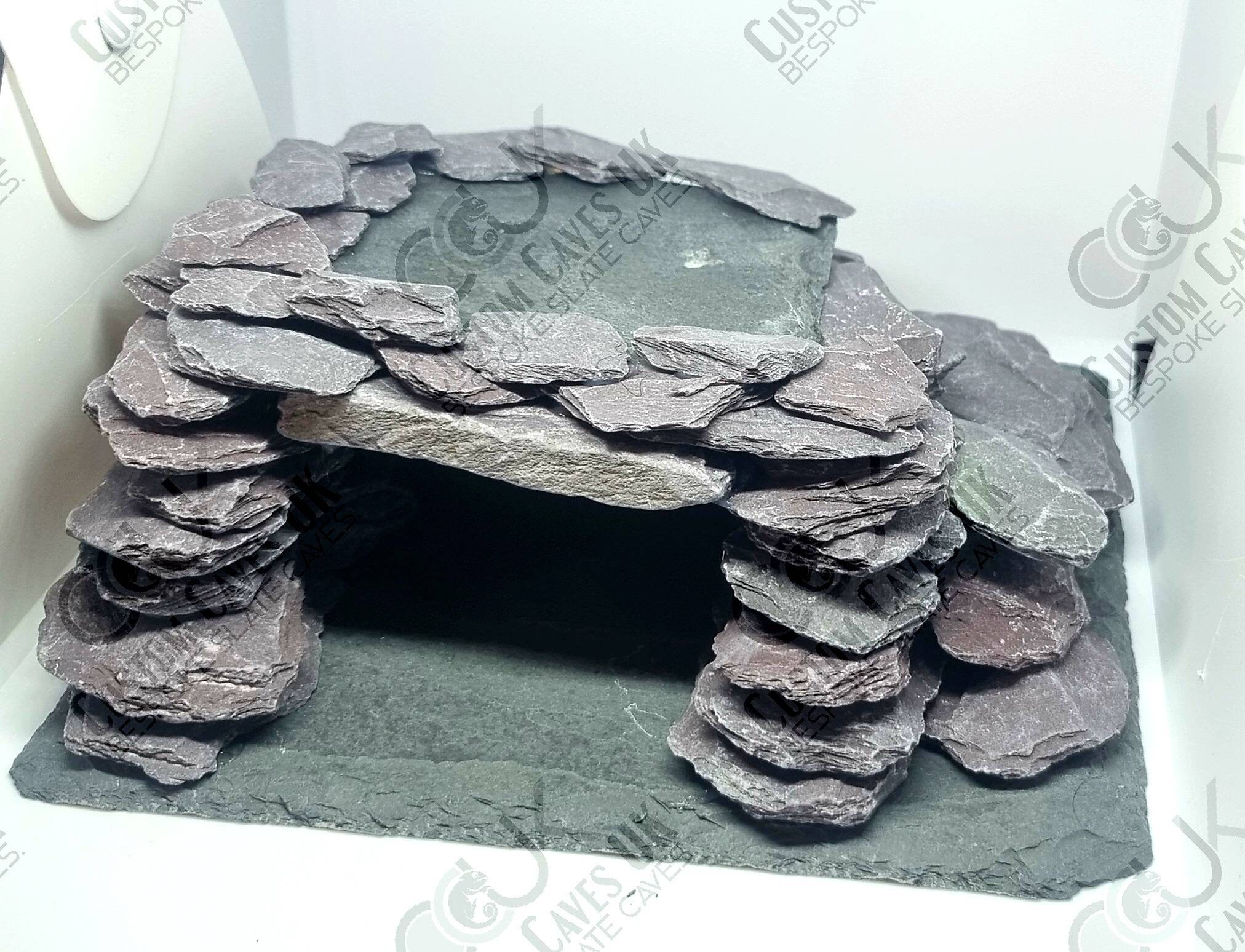 This is my new leopard geckos naturalistic set up. I used excavator clay to  make a túnel and a hide, I used a solid rock hide which will retain the  heat from