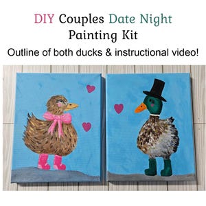 May include: DIY Couples Date Night Painting Kit featuring two duck paintings. One duck wears a pink bow and boots, the other a top hat and boots. The paintings are on blue canvases with pink heart accents.