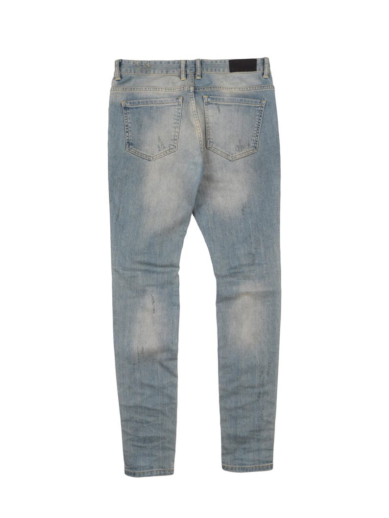 May include: Light blue denim jeans with distressed details and a faded look. The jeans have a slim fit and a straight leg.
