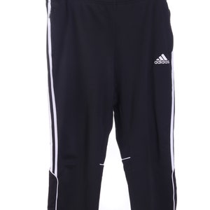 May include: Black sweatpants with white stripes down the sides and a white Adidas logo on the right leg.