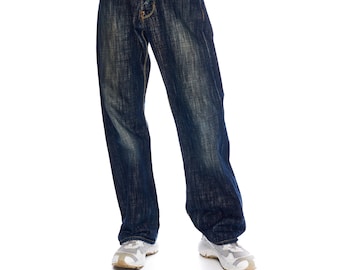 May include: A pair of dark blue denim jeans with a faded and distressed look. The jeans have a straight leg fit and are worn with white sneakers.