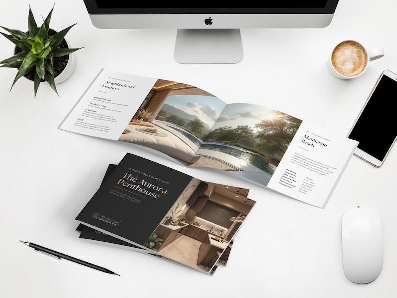 May include: A top-down view of a white desk with a computer, coffee cup, and a smartphone. Brochures titled "The Aurora Penthouse" and "Manhattan Beach" are open. A pen, mouse, and a potted plant are also on the desk.