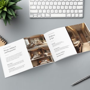 May include: An open brochure with the text "Private, Polished, and Purposeful" and "Wellness & Spa" is displayed on a gray surface. A keyboard, pen, coffee cup, and a potted plant are also visible.