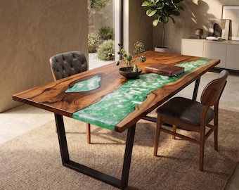 May include: A rectangular dining table featuring a natural wood slab with a live edge and a central river inlay made of swirling green resin. The table is supported by black metal U-shaped legs and is accompanied by two chairs with dark gray upholstery.