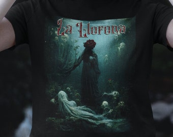 May include: Black t-shirt with a graphic print of a woman in a white dress with a red rose on her head. The text "La Llorona" is printed in a gothic font above the image.