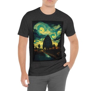 May include: A dark heather grey t-shirt with a graphic print of a large moth standing in a field with a starry night sky in the background. The graphic is reminiscent of Vincent van Gogh's "Starry Night" painting.